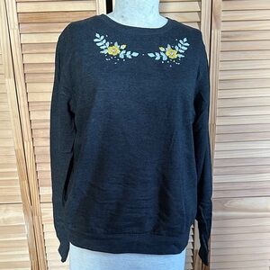 Locher’s Floral Embroidered Black Sweatshirt French Profanity